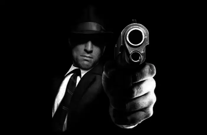 Mobster pointing a gun